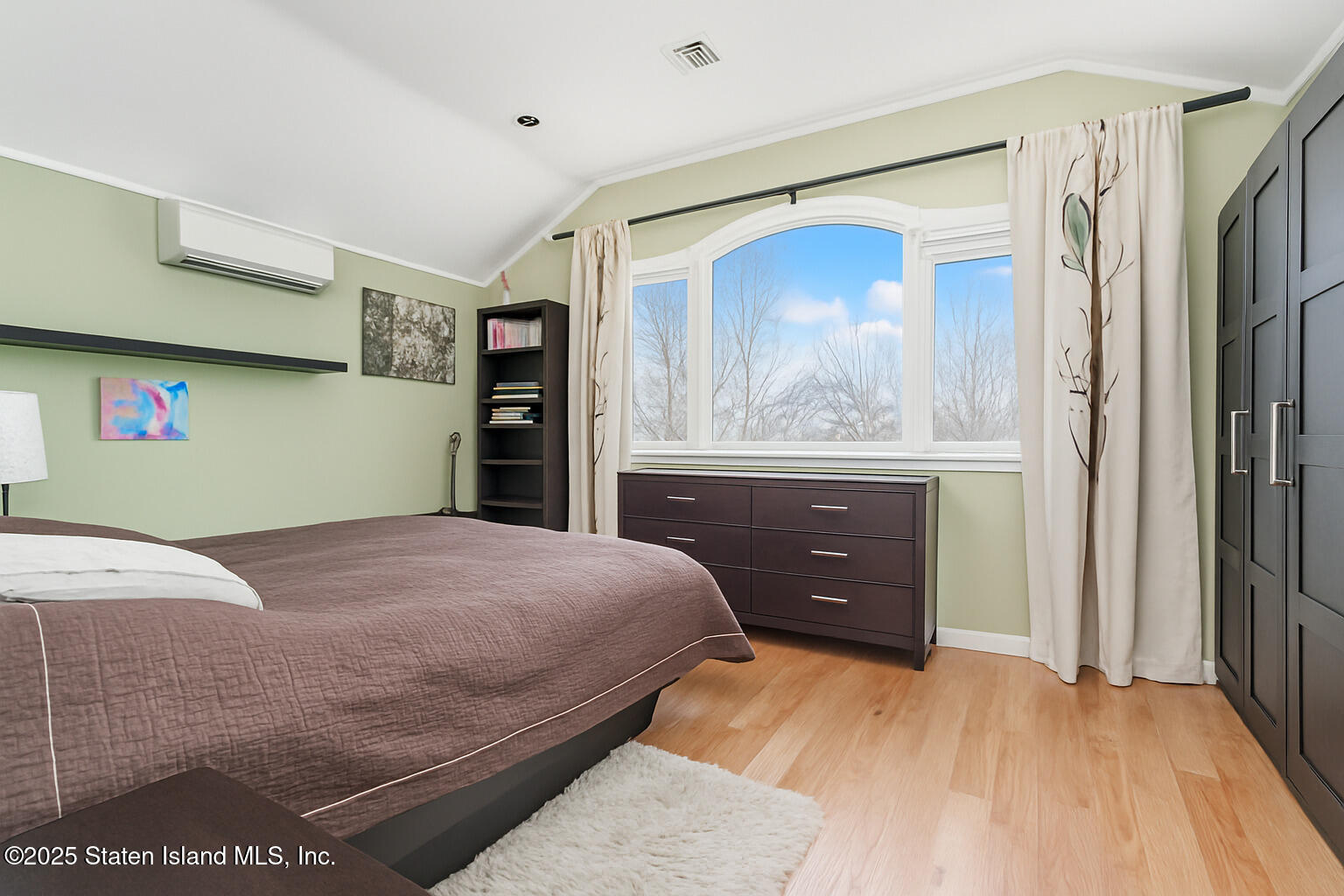 Undisclosed Address Staten Island, NY 10309 - Photo 28 of 40 a bedroom with a bed and a dresser