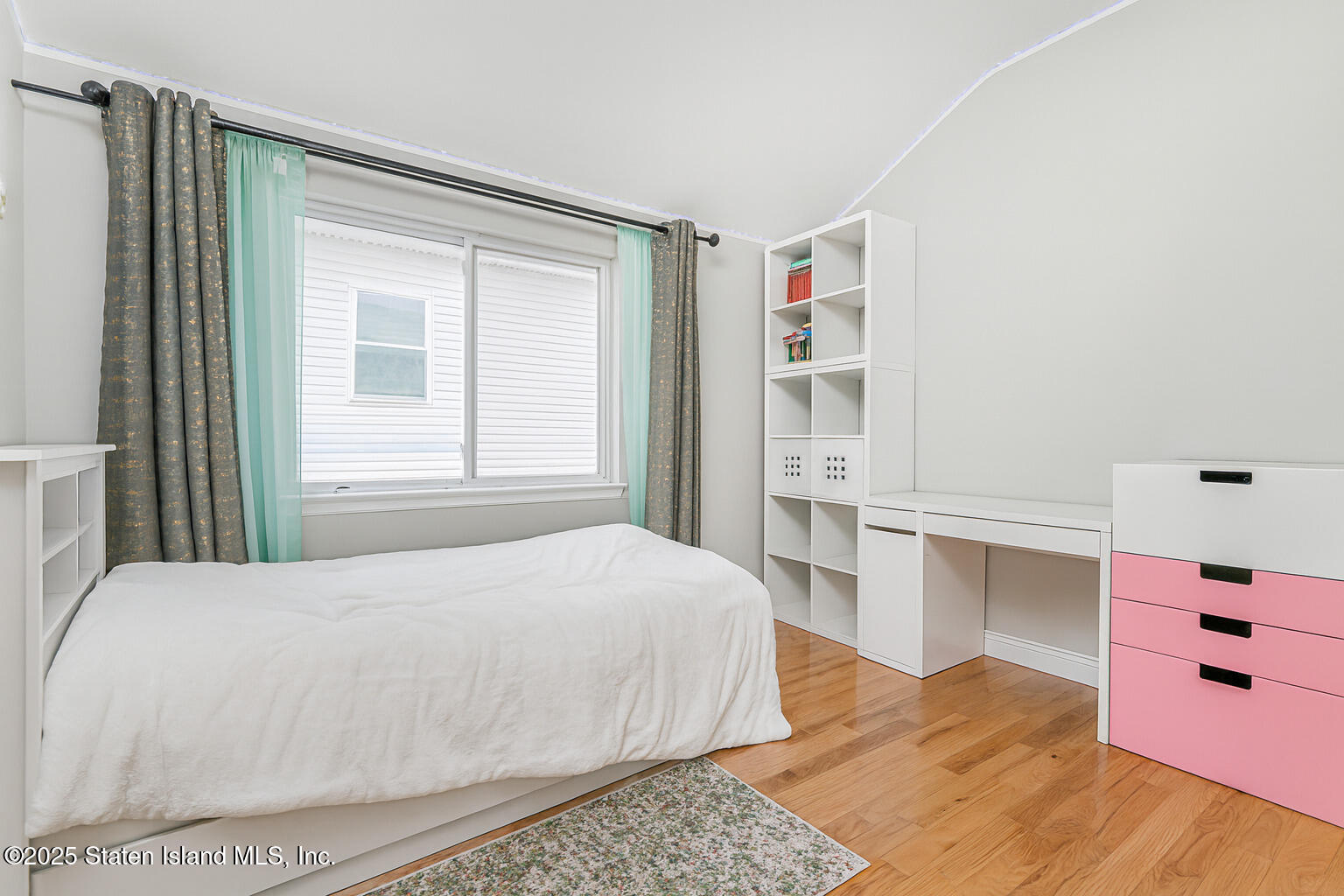 Undisclosed Address Staten Island, NY 10309 - Photo 32 of 40 a bedroom with a bed and cabinets