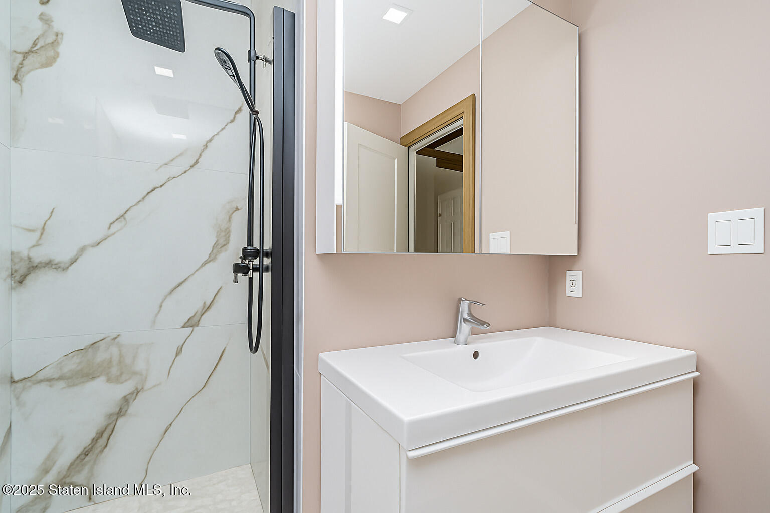 Undisclosed Address Staten Island, NY 10309 - Photo 37 of 40 a bathroom with a sink and mirror