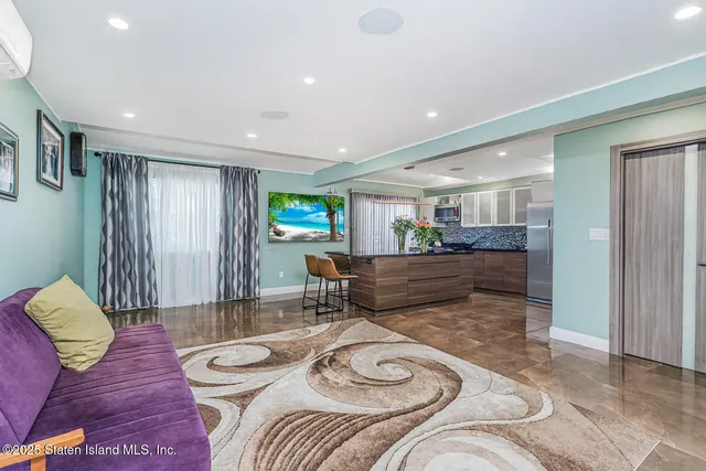 a room with table chairs and wooden floor