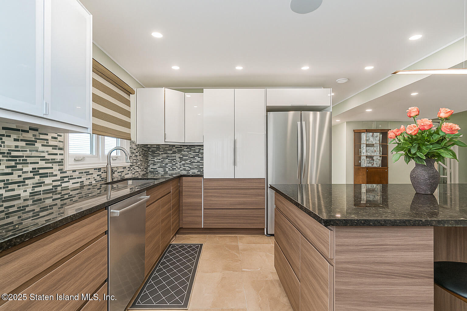Undisclosed Address Staten Island, NY 10309 - Photo 7 of 40 a kitchen with kitchen island granite countertop a sink and a refrigerator