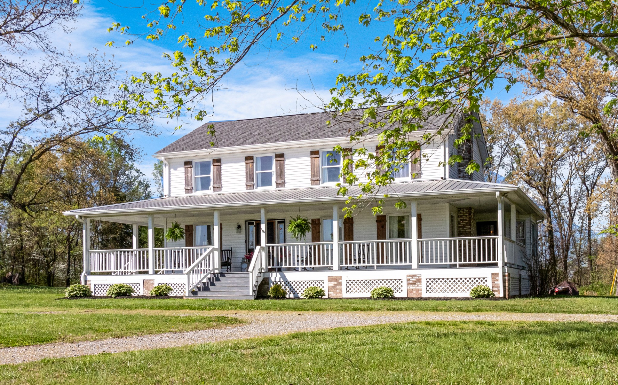 3860 Head Road Adams, TN 37010 - Photo 1 of 32 a front view of a house with a garden and trees