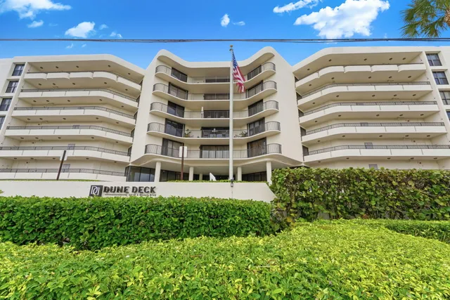 a view of a patio with a table and chairs