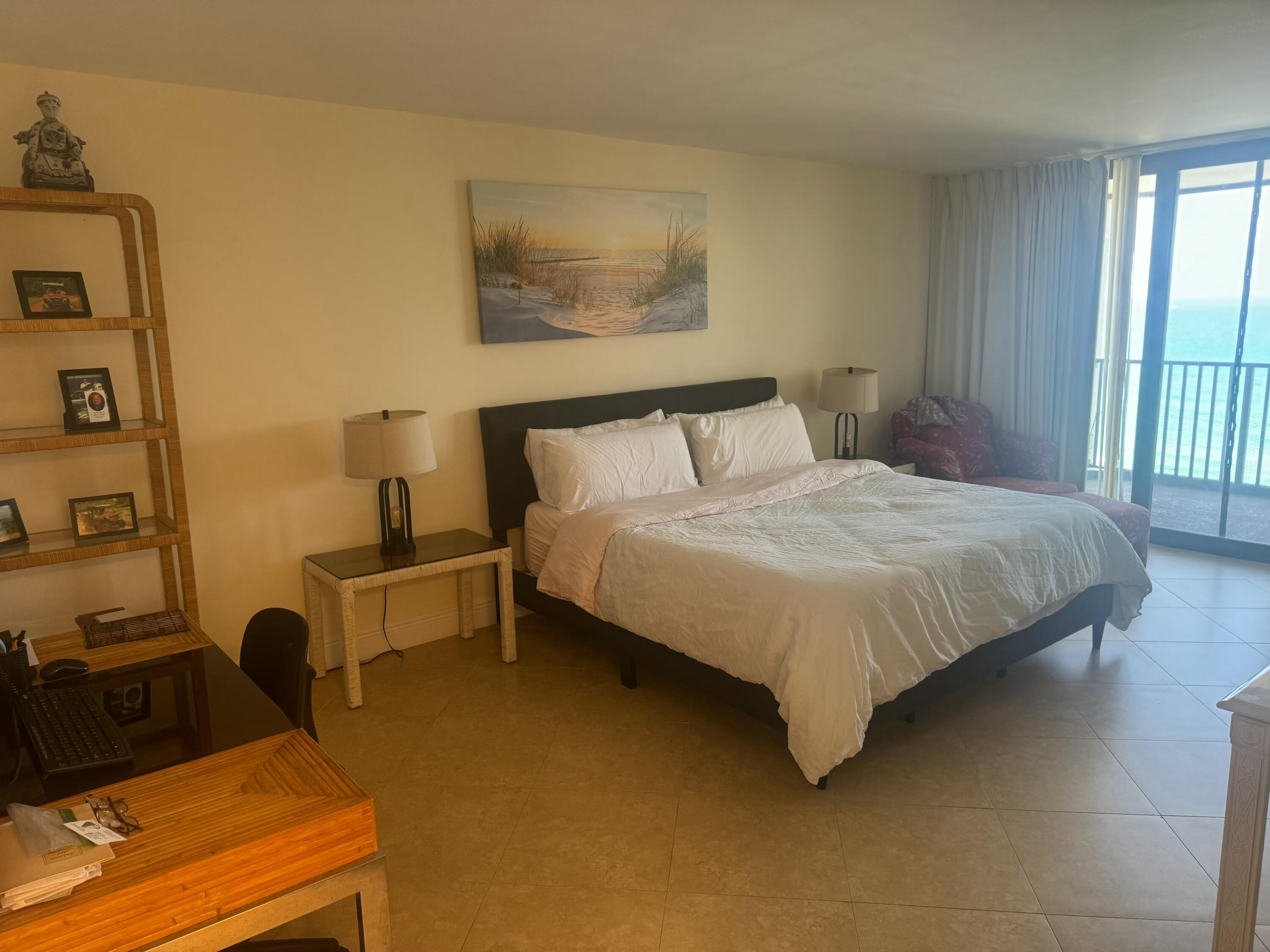 3610 South Ocean Boulevard, Unit 610 South Palm Beach, FL 33480 - Photo 5 of 14 a bedroom with beds and a window