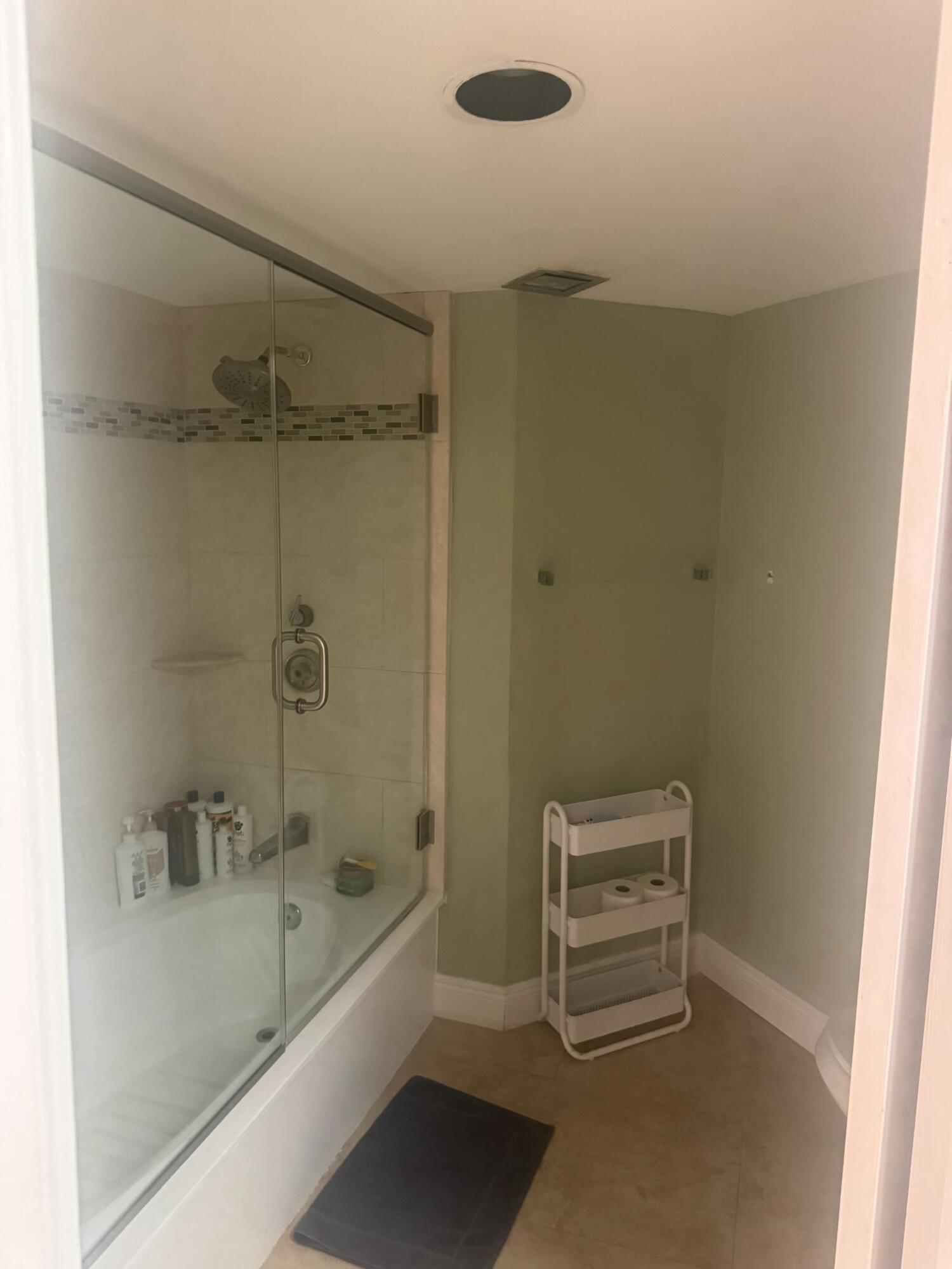 3610 South Ocean Boulevard, Unit 610 South Palm Beach, FL 33480 - Photo 7 of 14 a bathroom with a bathtub and a shower