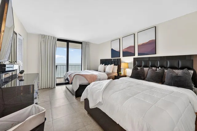 a bathroom with a tub shower sink and toilet