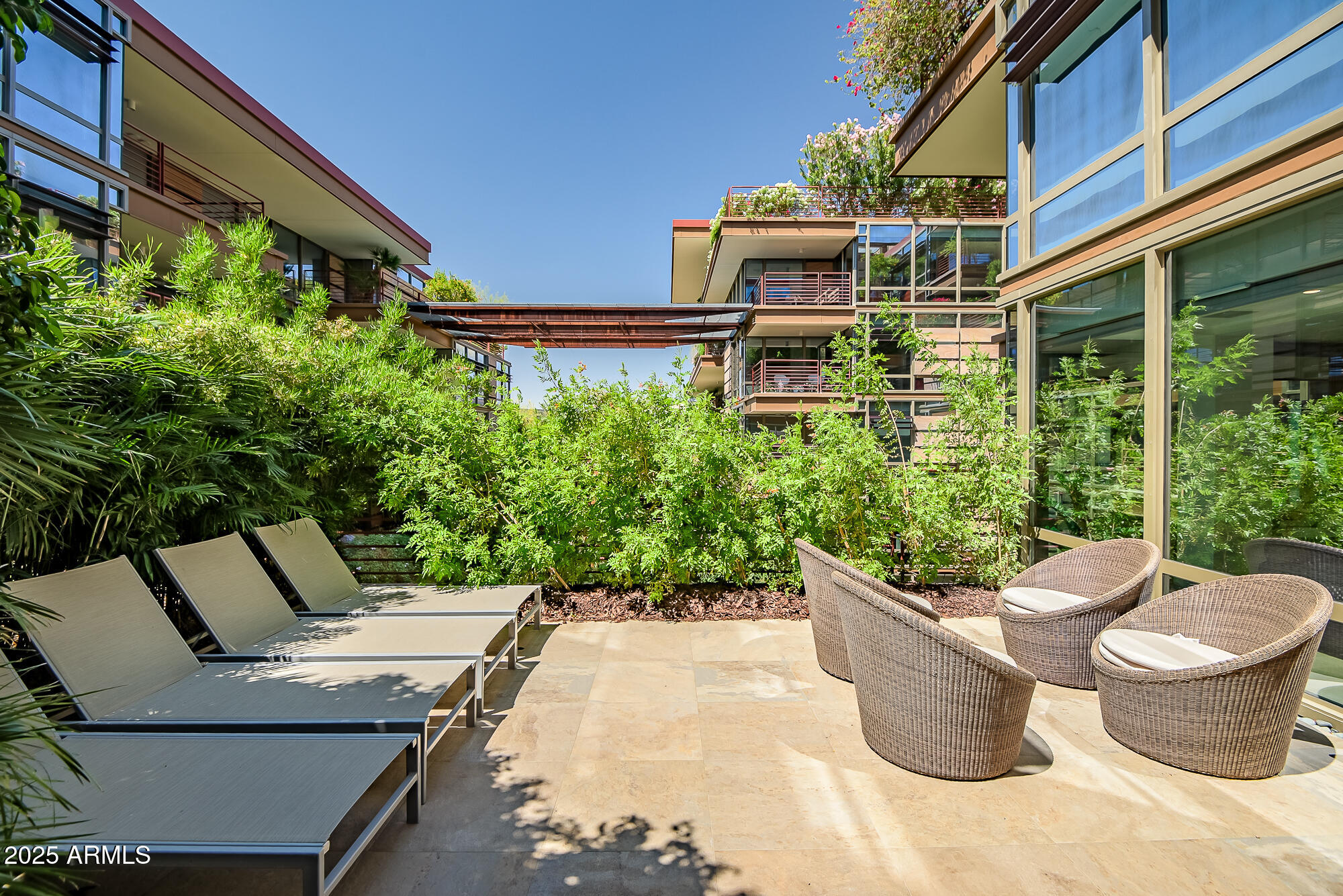 7127 East Rancho Vista Drive, Unit 4012 Scottsdale, AZ 85251 - Photo 1 of 1 a view of a backyard with plants and chairs