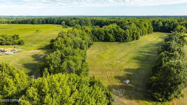 a view of a lake with a yard
