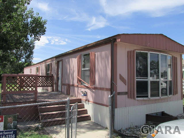424 32 Road, Unit 151 Clifton, CO 81520 - Photo 1 of 12 a front view of a house with parking space