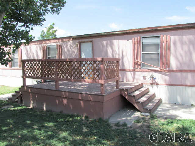 424 32 Road, Unit 151 Clifton, CO 81520 - Photo 9 of 12 a view of house with backyard