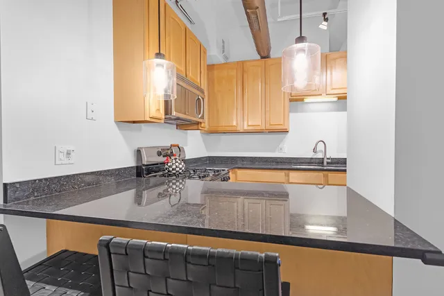 a bedroom with a bed and a workspace