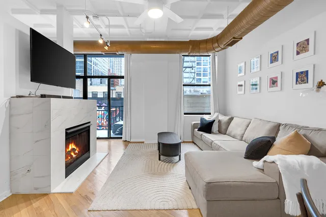 a view of a balcony with wooden floor and fence