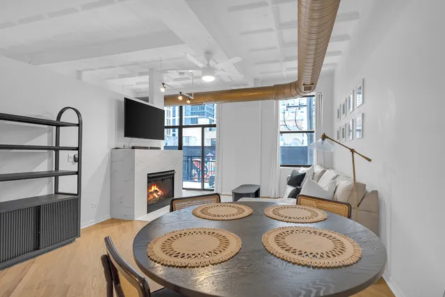 a kitchen with stainless steel appliances granite countertop a refrigerator a stove and a sink with cabinets