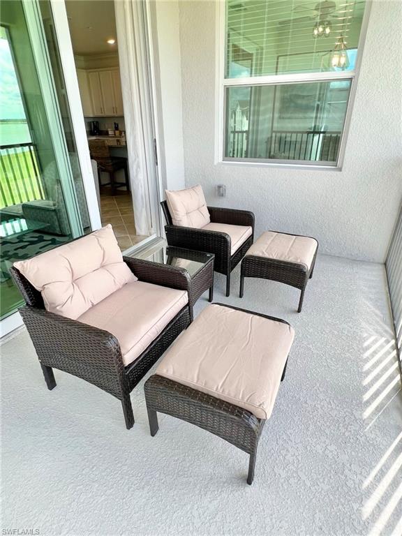 43020 Greenway Boulevard, Unit 345 Babcock Ranch, FL 33982 - Photo 16 of 42 a living room with furniture and a window