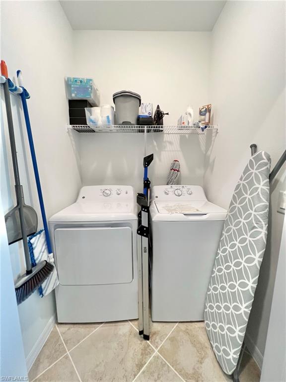 43020 Greenway Boulevard, Unit 345 Babcock Ranch, FL 33982 - Photo 17 of 42 a utility room with dryer and washer