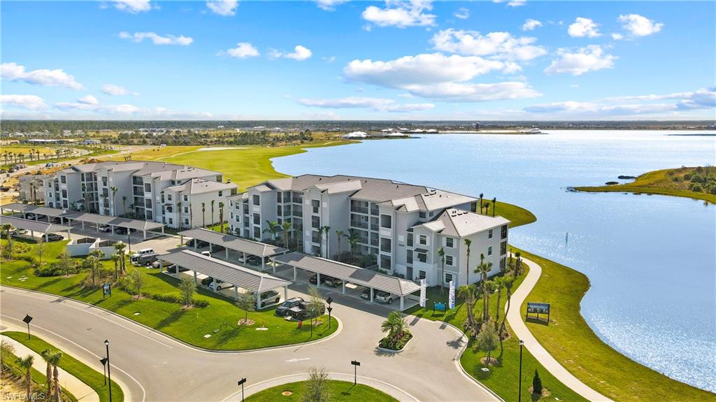 43020 Greenway Boulevard, Unit 345 Babcock Ranch, FL 33982 - Photo 20 of 42 a view of a swimming pool with outdoor seating