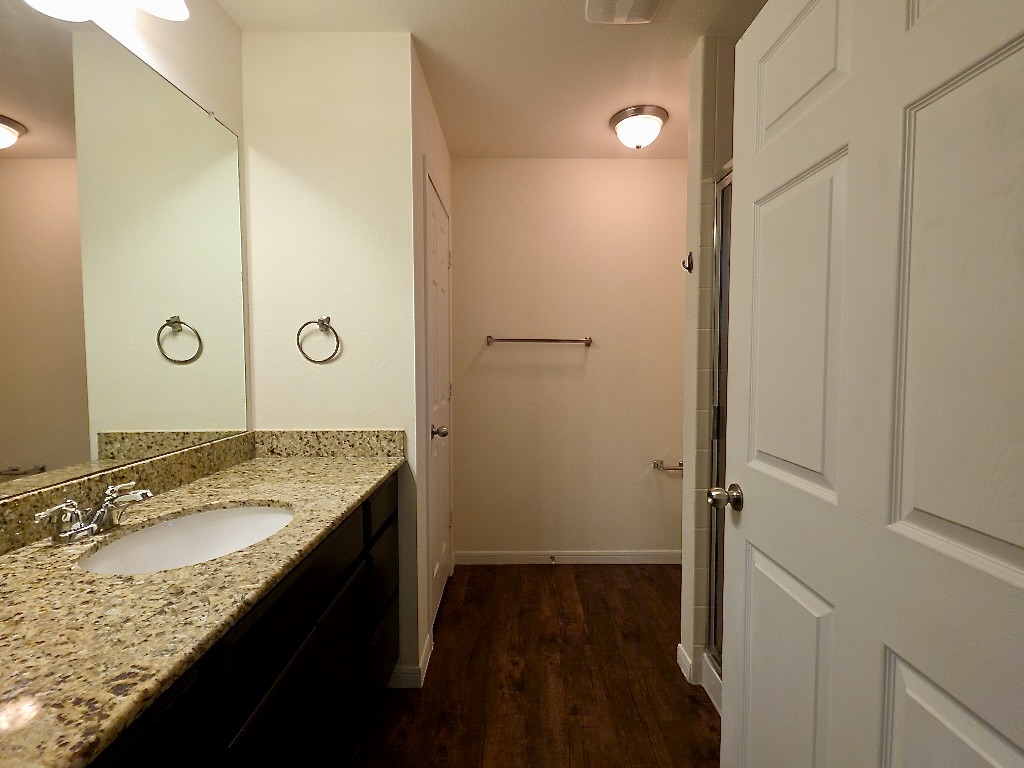 306 Wyeth Street Taylor, TX 76574 - Photo 11 of 20 Bathroom with laminate flooring .