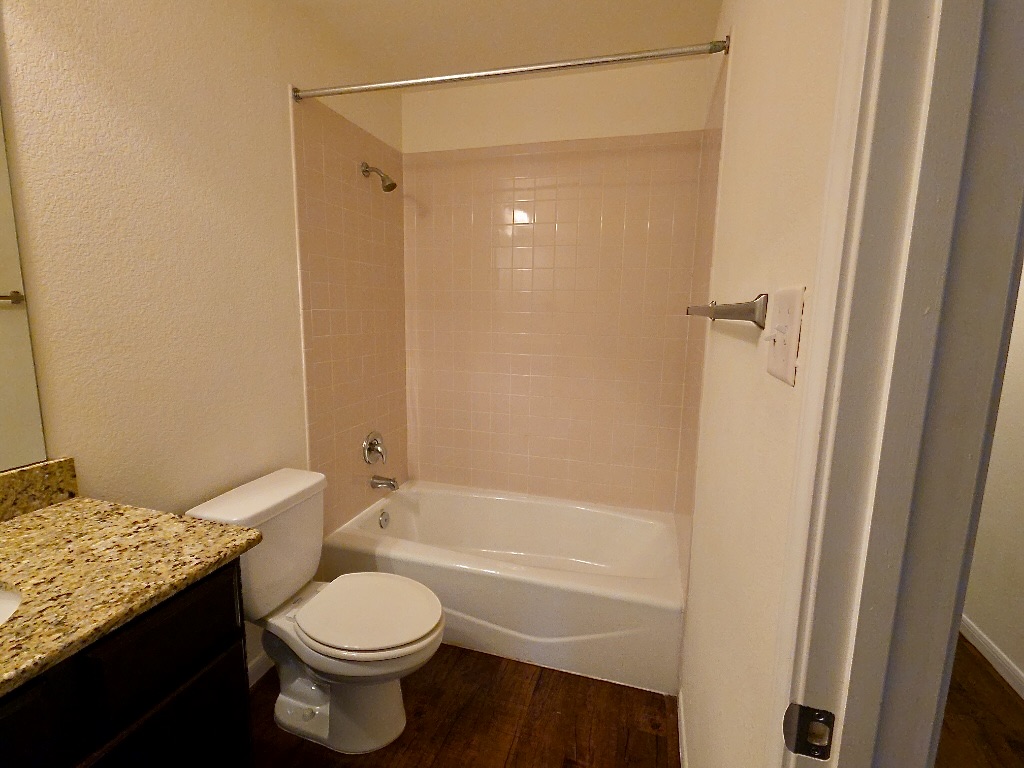 306 Wyeth Street Taylor, TX 76574 - Photo 14 of 20 Bathroom with tub and shower combo
