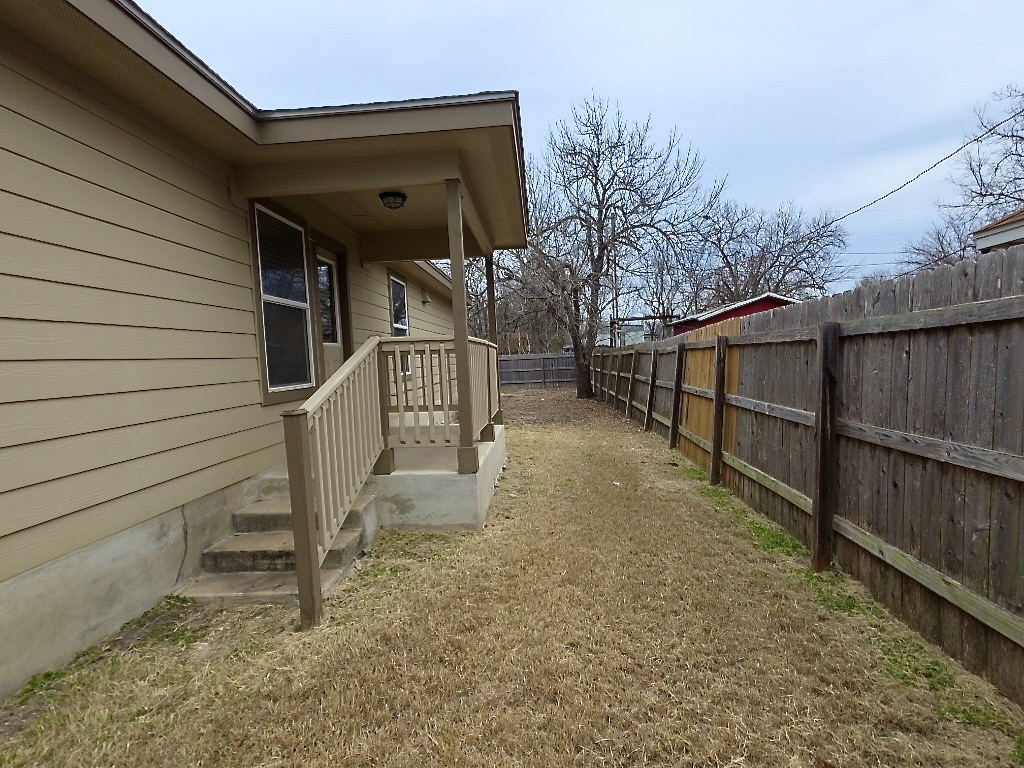 306 Wyeth Street Taylor, TX 76574 - Photo 17 of 20 Back door off side of home to the large fenced backyard.