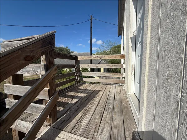 a kitchen with granite countertop a sink a stove and cabinets