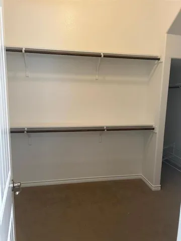 a view of a room with rack on the wall