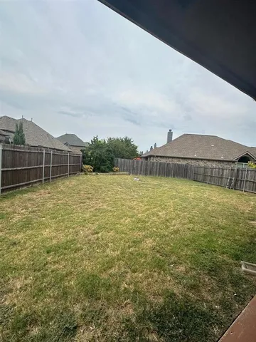 a view of backyard with porch