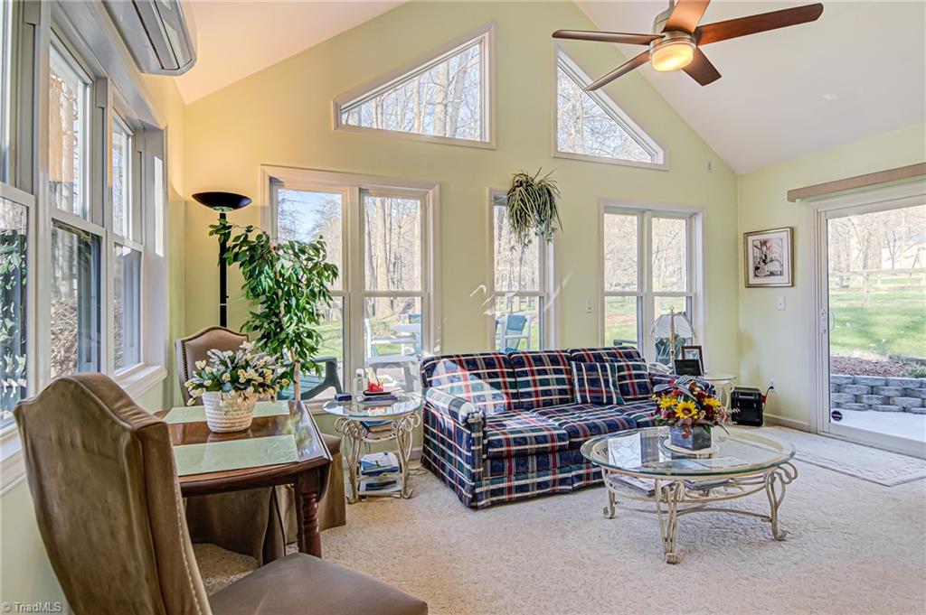 7503 Bartonshire Court Oak Ridge, NC 27310 - Photo 11 of 24 Sunroom with easy access to the patio and deck. Great for entertaining.