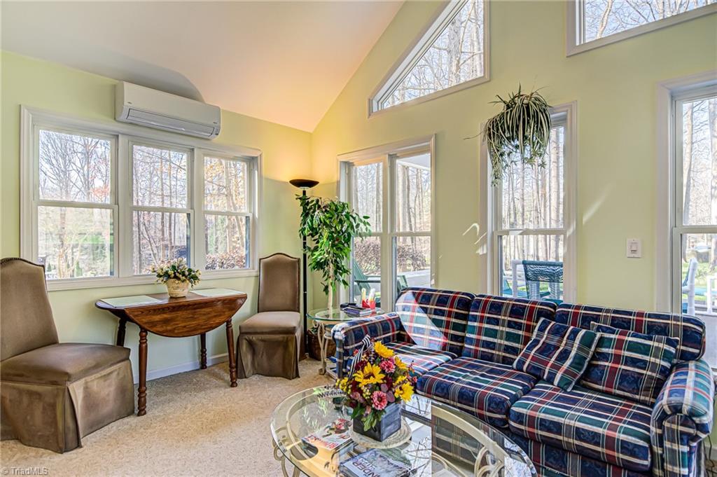 7503 Bartonshire Court Oak Ridge, NC 27310 - Photo 12 of 24 Great views to backyard and natural beauty from the Sunroom.