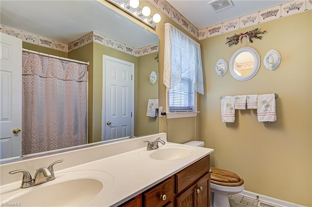 7503 Bartonshire Court Oak Ridge, NC 27310 - Photo 17 of 24 Primary Bath with double sink vanity.