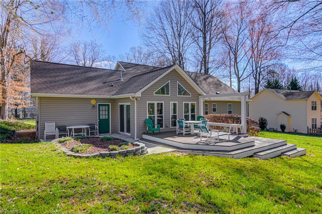 7503 Bartonshire Court Oak Ridge, NC 27310 - Photo 22 of 24 Deck and patio just off the Sunroom. Great for cookouts!