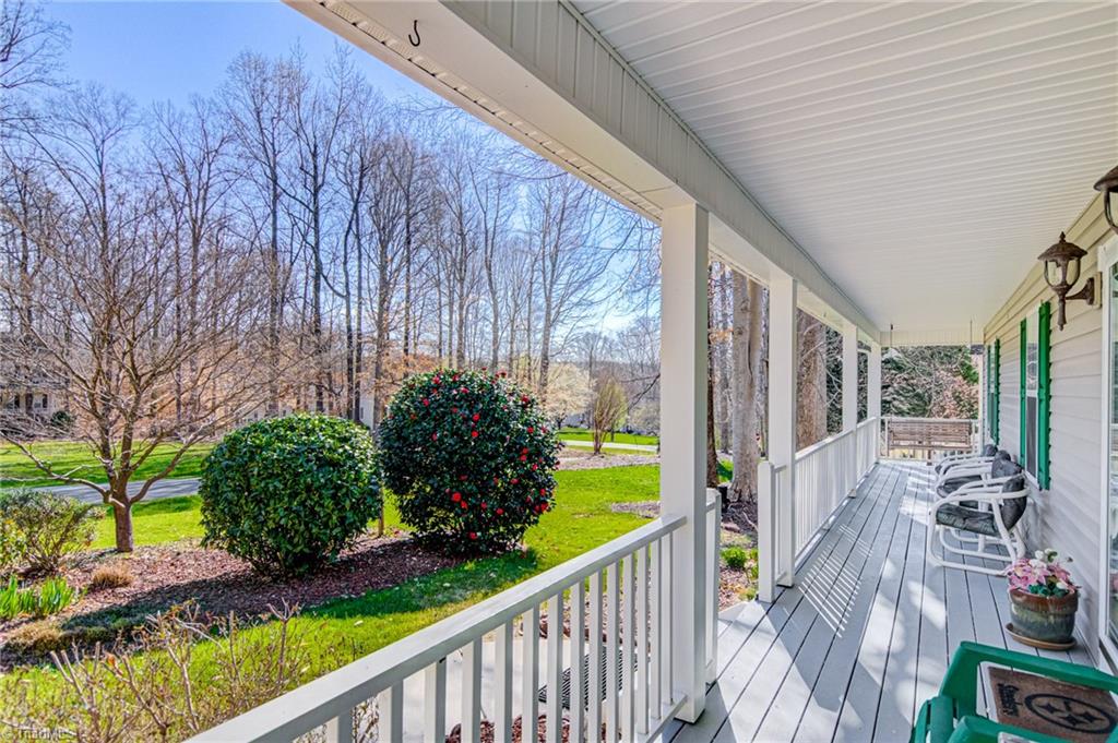 7503 Bartonshire Court Oak Ridge, NC 27310 - Photo 3 of 24 Rocking chair Front Porch.