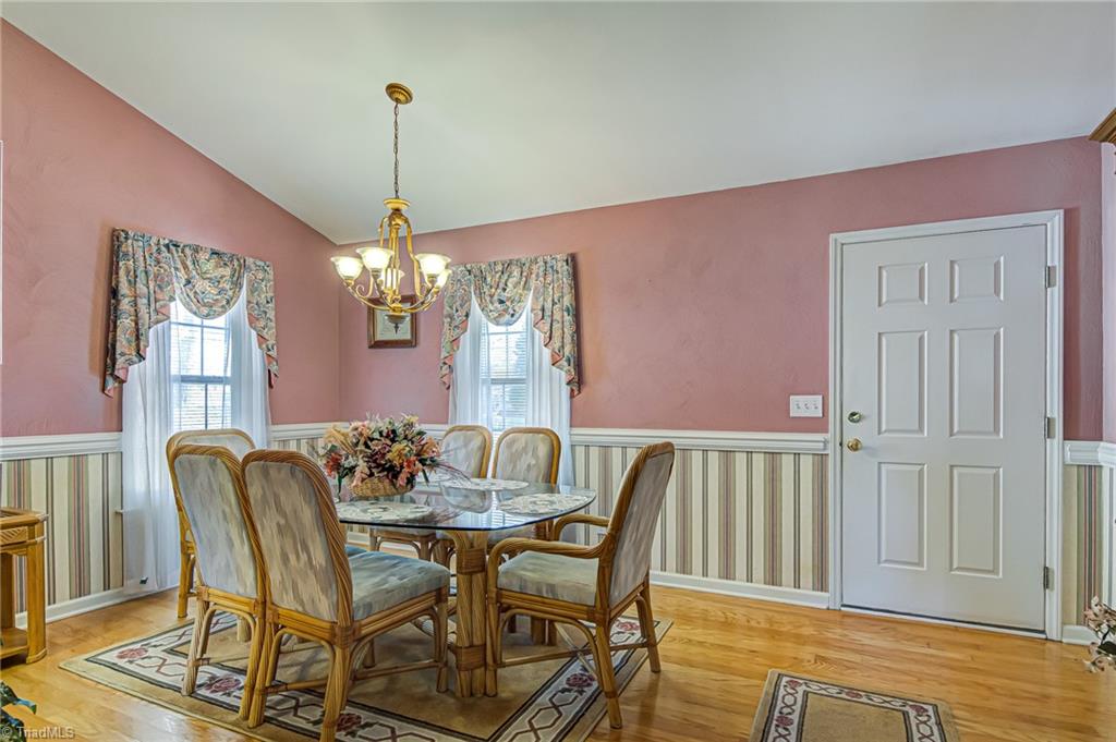 7503 Bartonshire Court Oak Ridge, NC 27310 - Photo 6 of 24 Dining room with hardwood flooring.