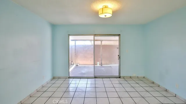 a view of an empty room and window
