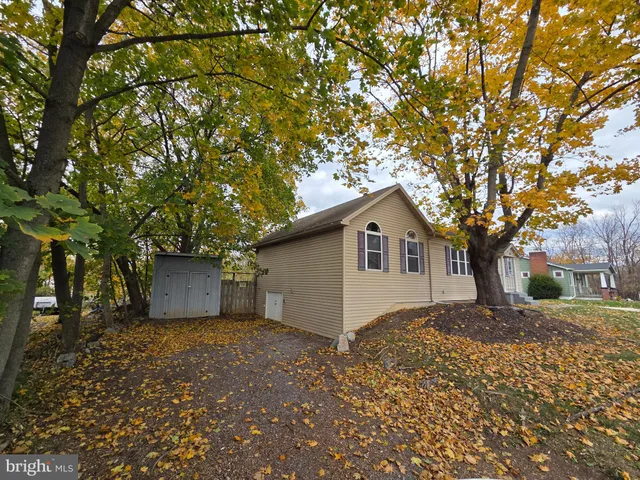 a house with a tree in front of it