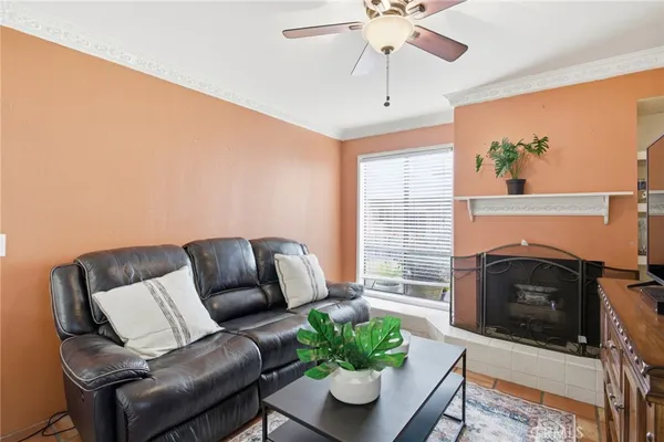 a living room with furniture and a fireplace