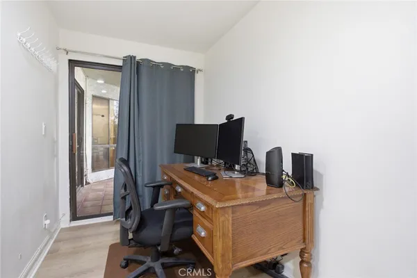 a workspace with furniture and wooden floor