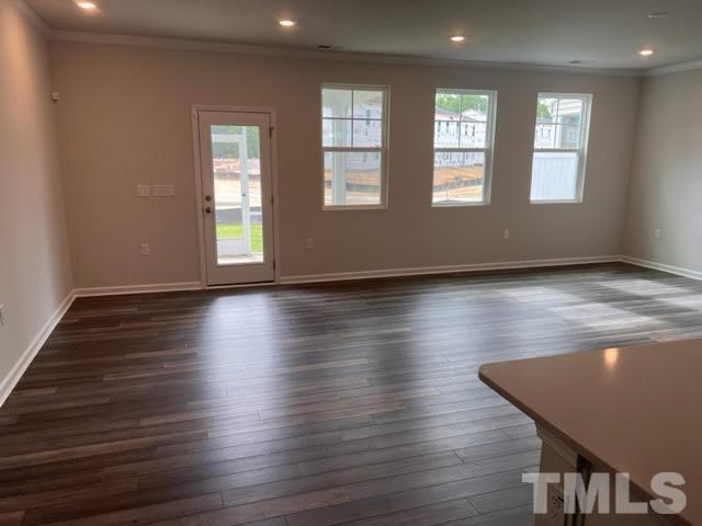 2403 Chert Lane, Unit 2403 Raleigh, NC 27610 - Photo 6 of 19 a view of an empty room with wooden floor and a window