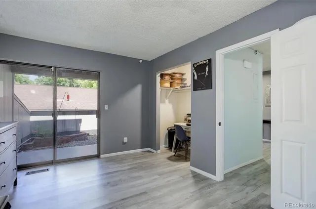 a workspace with furniture and wooden floor