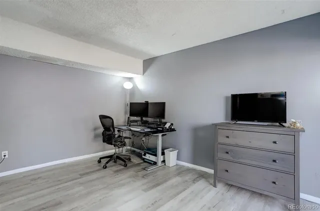 a living room with a couch and a flat screen tv