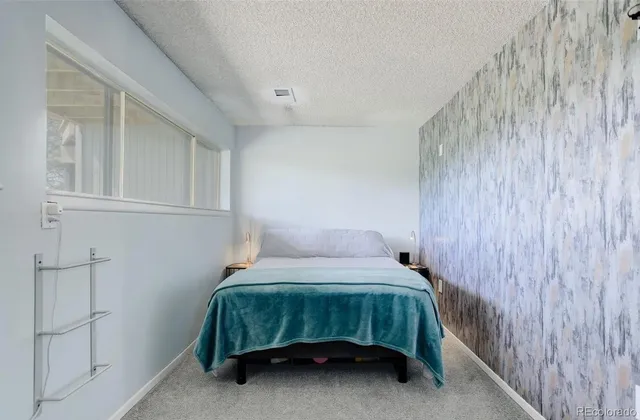 a bathroom with a sink shower and a mirror