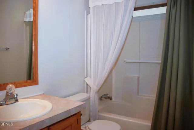 a bathroom with a sink a toilet and a bathtub