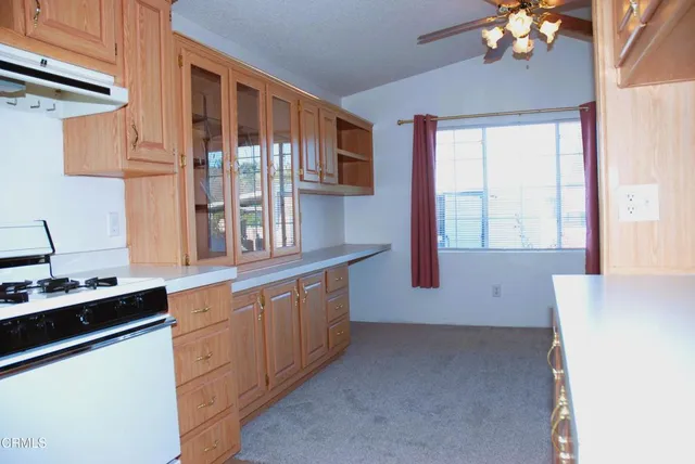a kitchen with cabinets a sink and dishwasher