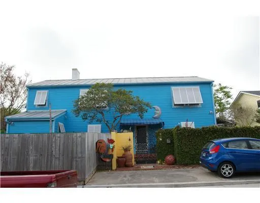 a front view of a house with parking space
