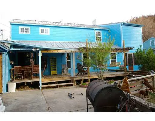 a backyard of a house with seating space