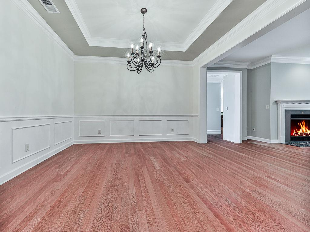 626 Laurel Crossing Canton, GA 30114 - Photo 11 of 77 wooden floor in an empty room with a window