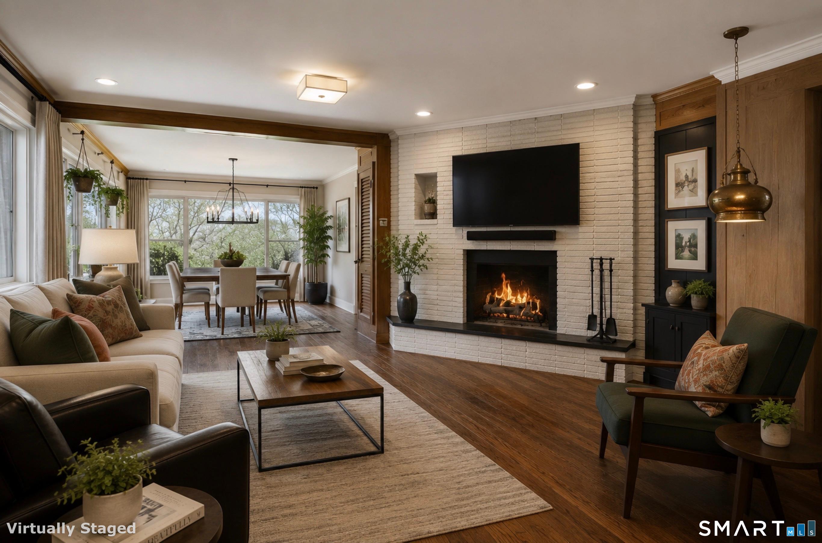 7 Sasqua Road Norwalk, CT 06855 - Photo 11 of 40 a living room with furniture a flat screen tv and a fireplace