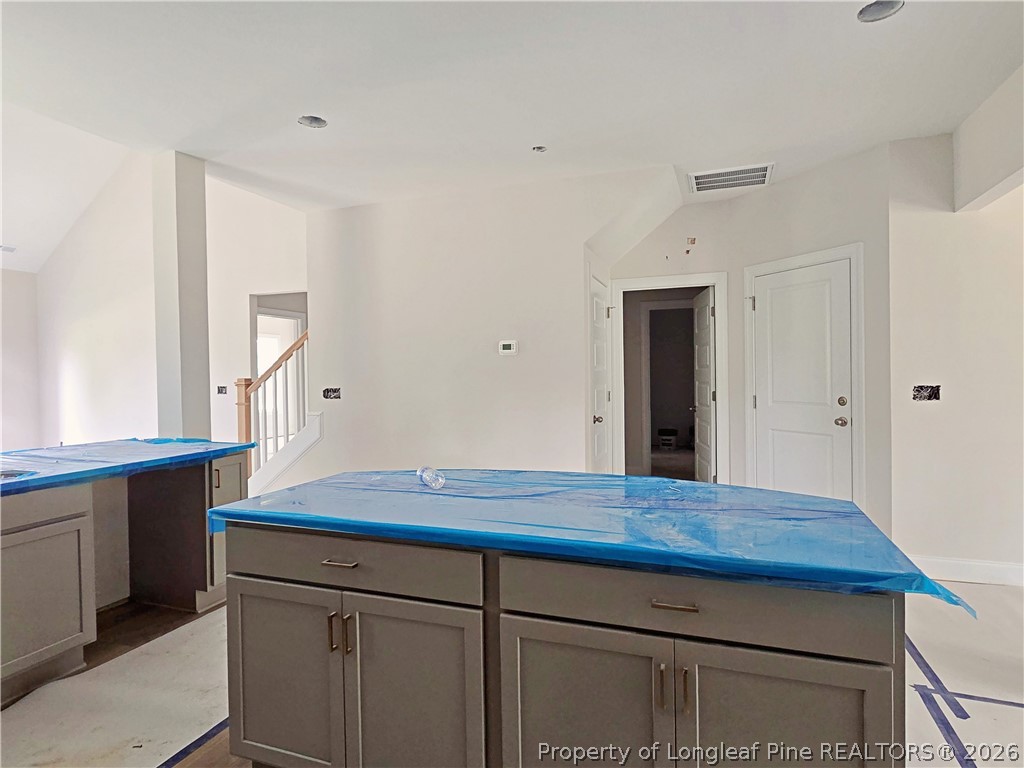 2678 Norrington Road Lillington, NC 27546 - Photo 8 of 31 a view of cabinets and wooden floor