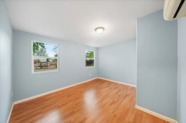 a view of a room with a bed and a window