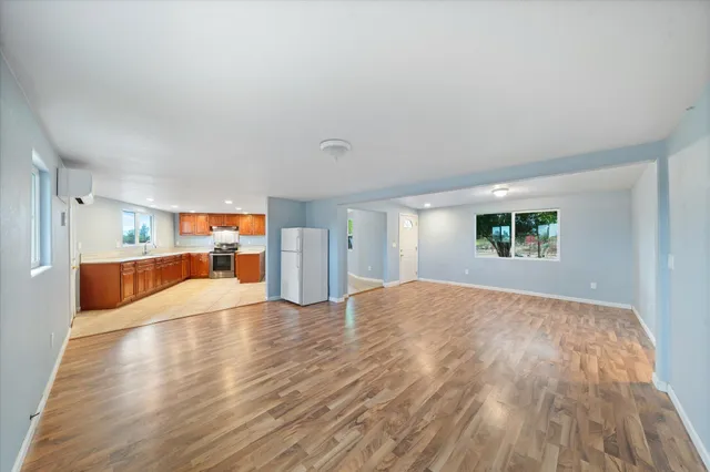 a living room with furniture a rug and a window