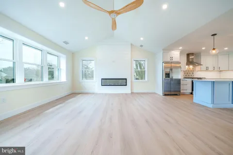 a view of a kitchen with a sink and a window